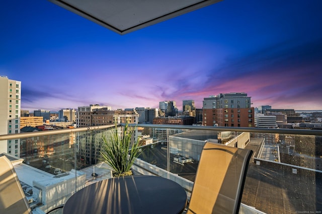 view of balcony at dusk