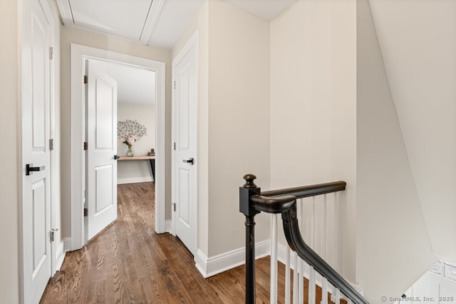 hall featuring crown molding and dark hardwood / wood-style flooring