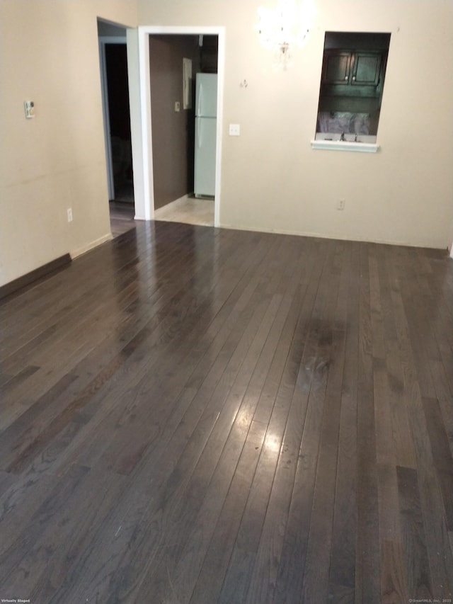 empty room featuring wood-type flooring