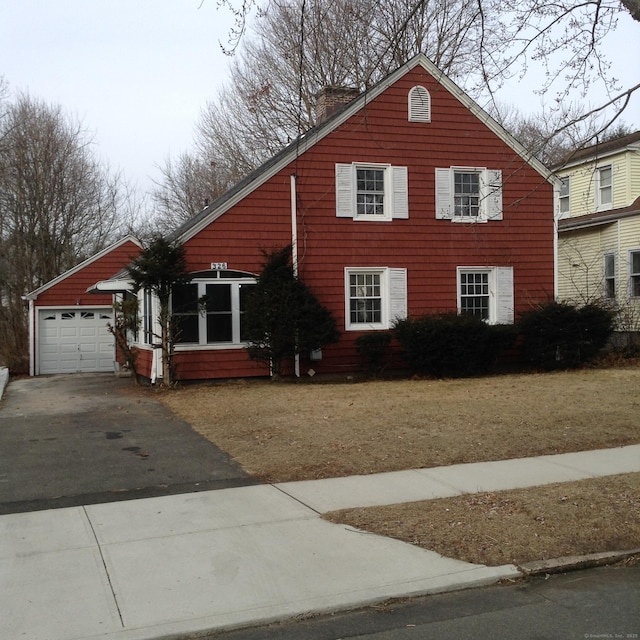 view of front of house with an outbuilding and a garage