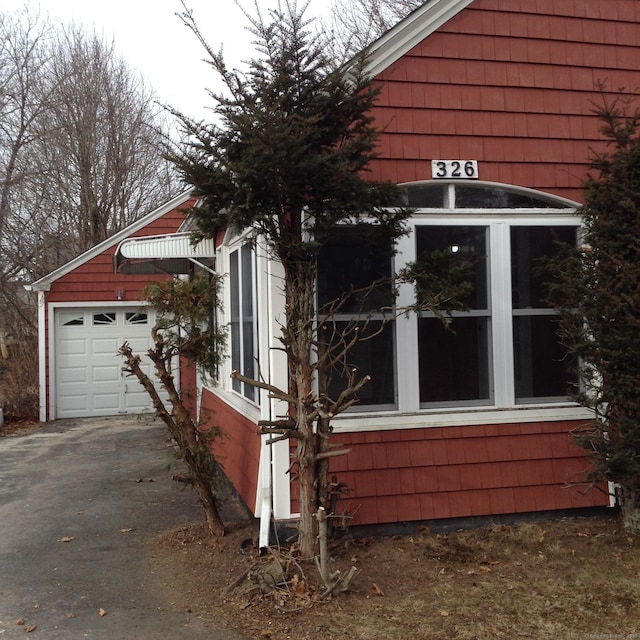 view of side of property featuring a garage