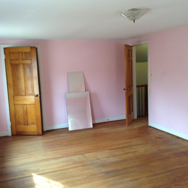 unfurnished room with light hardwood / wood-style flooring