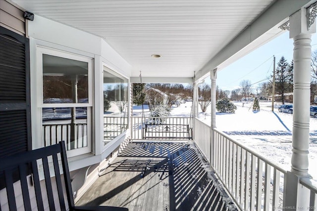 view of snow covered deck