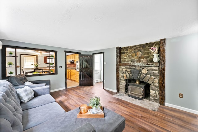 living room featuring hardwood / wood-style floors and a textured ceiling