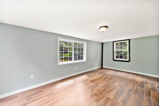 spare room featuring hardwood / wood-style floors