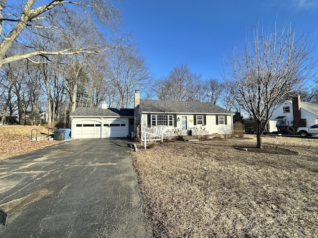 single story home featuring a garage