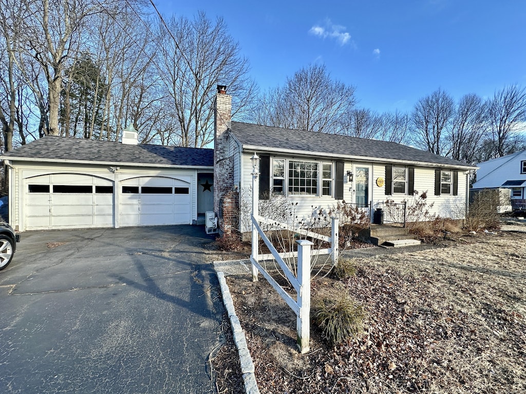 ranch-style home with a garage