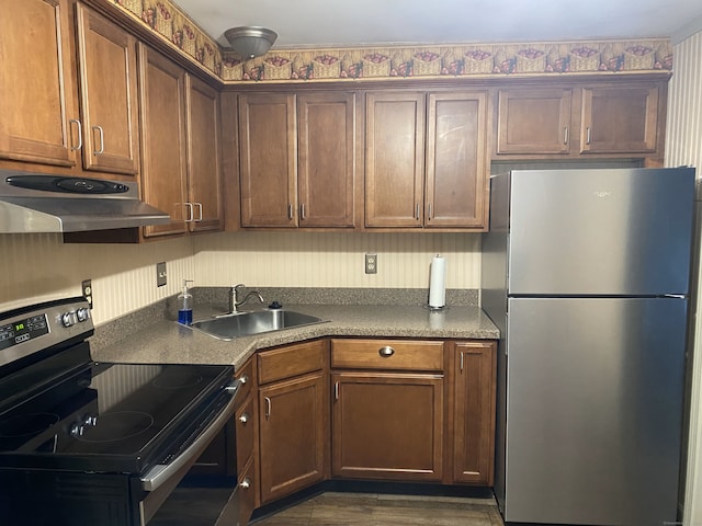 kitchen with sink and appliances with stainless steel finishes