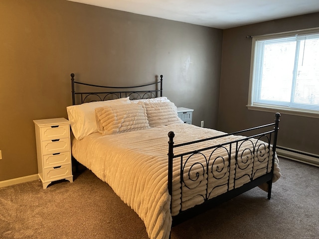 bedroom with dark colored carpet