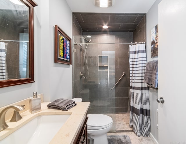 bathroom with a shower with shower curtain, vanity, and toilet