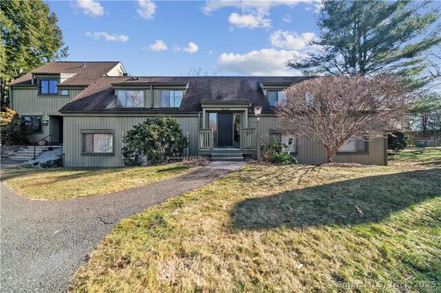 view of front of home with a front yard