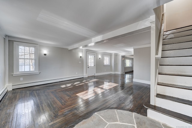 interior space with a baseboard radiator, dark hardwood / wood-style flooring, and a wealth of natural light