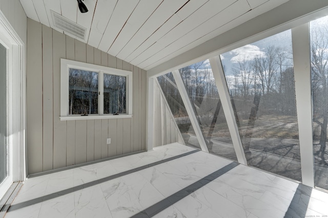 sunroom with vaulted ceiling and a wealth of natural light
