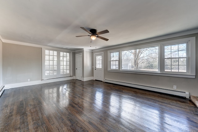 empty room with dark wood-type flooring, ceiling fan, and baseboard heating