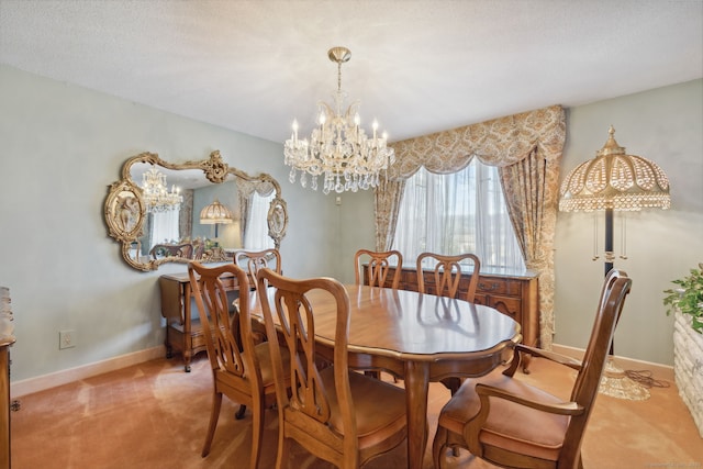 dining area with light colored carpet, a chandelier, and a textured ceiling