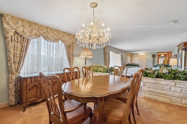 dining area with light carpet and a notable chandelier