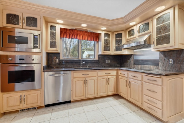 kitchen featuring extractor fan, stainless steel appliances, light tile patterned flooring, light brown cabinetry, and sink