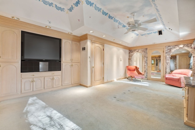 living room with ceiling fan, light colored carpet, and a tray ceiling