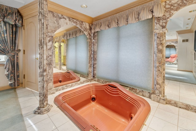 bathroom featuring crown molding, tile patterned floors, and a bathing tub