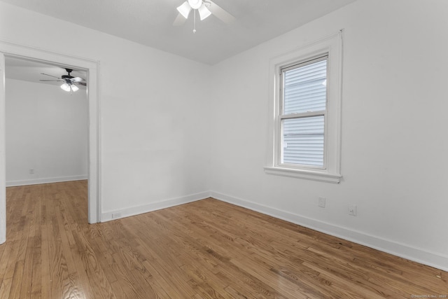 spare room with ceiling fan and light hardwood / wood-style flooring