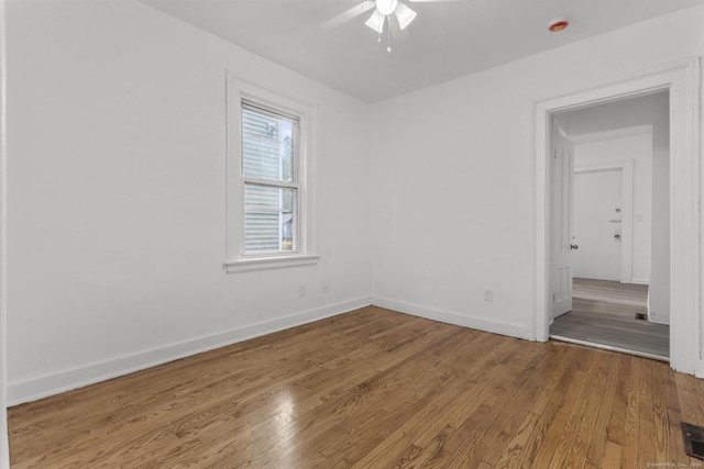 unfurnished room featuring hardwood / wood-style floors and ceiling fan