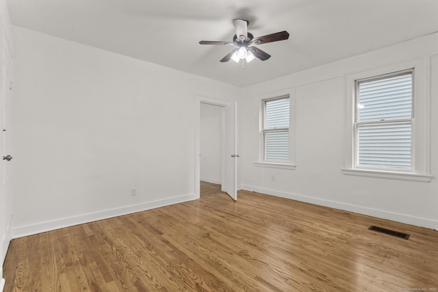 spare room featuring ceiling fan and light hardwood / wood-style floors