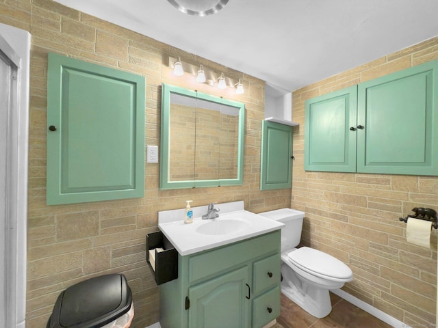 bathroom with toilet and vanity