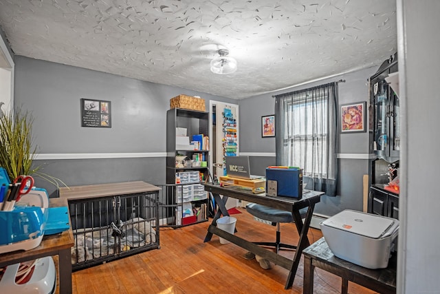 office area featuring a textured ceiling and hardwood / wood-style flooring