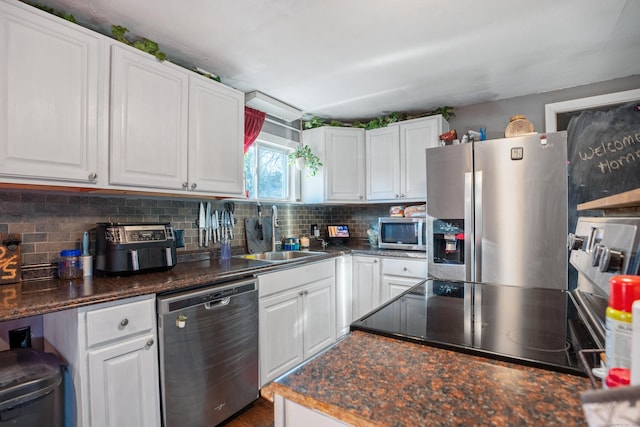 kitchen with white cabinets, sink, and stainless steel appliances