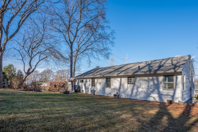 view of home's exterior with a yard