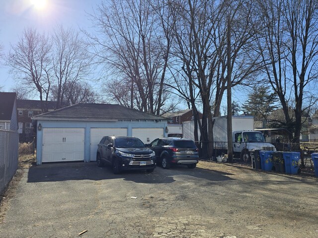 view of front of house featuring an outdoor structure and a garage