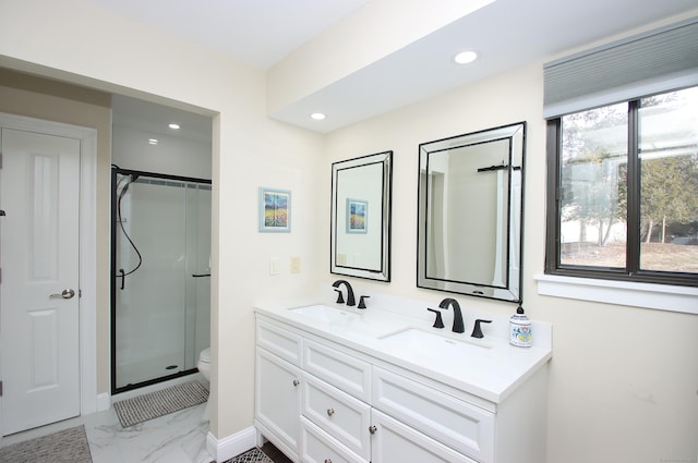 bathroom featuring walk in shower, vanity, and toilet