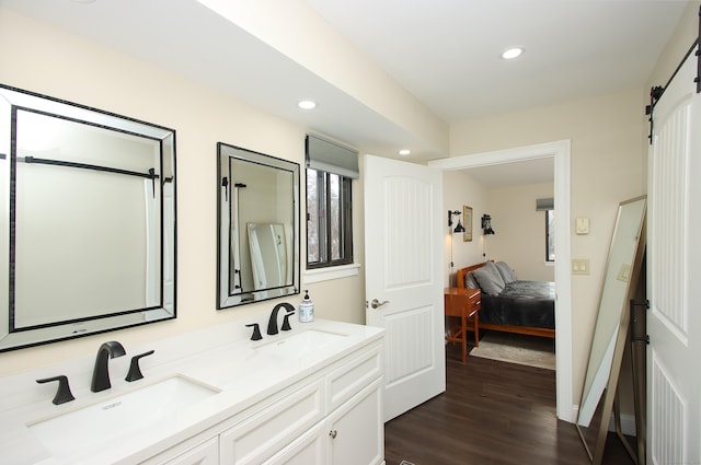 bathroom featuring vanity and hardwood / wood-style flooring