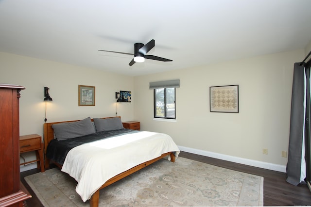 bedroom featuring ceiling fan and dark hardwood / wood-style floors