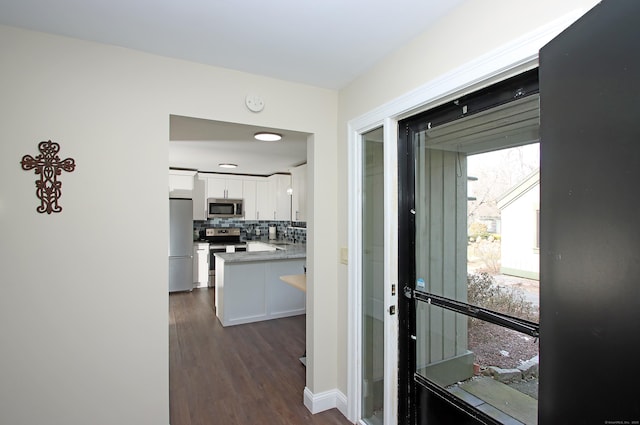 doorway to outside featuring dark hardwood / wood-style flooring