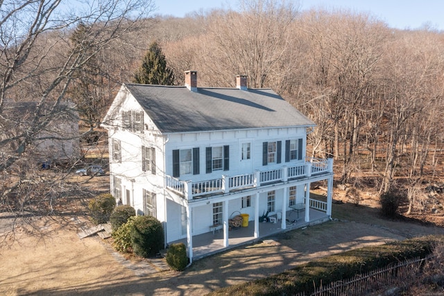 back of property featuring a patio