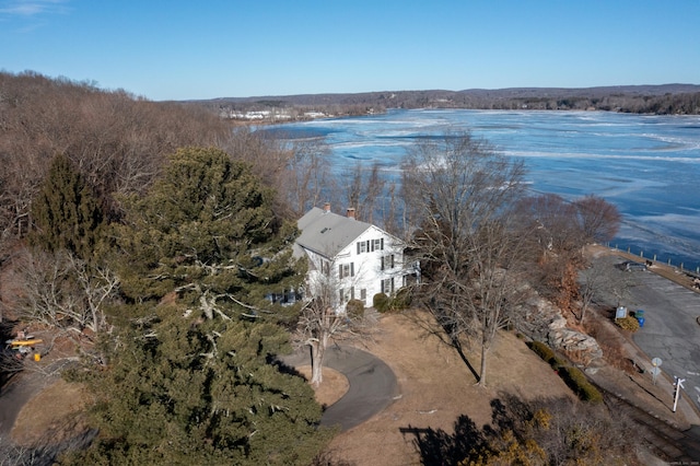 birds eye view of property with a water view