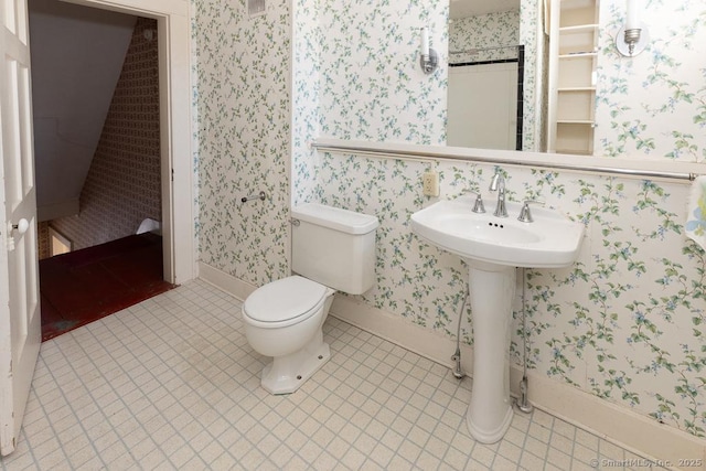 bathroom featuring tile patterned floors and toilet