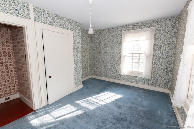 interior space with dark colored carpet