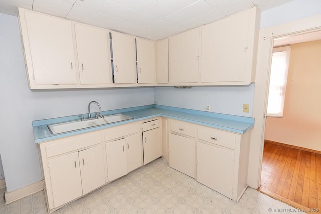 kitchen with sink and white cabinets