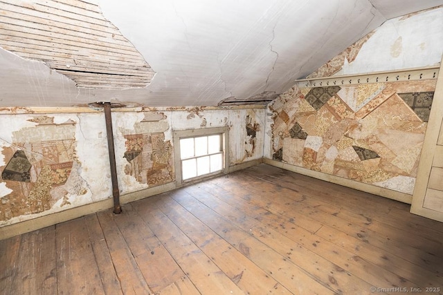 bonus room featuring hardwood / wood-style flooring and lofted ceiling