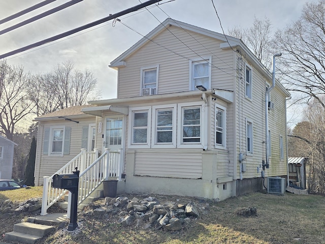 view of front of property featuring cooling unit