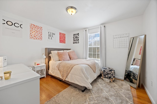 bedroom with hardwood / wood-style flooring