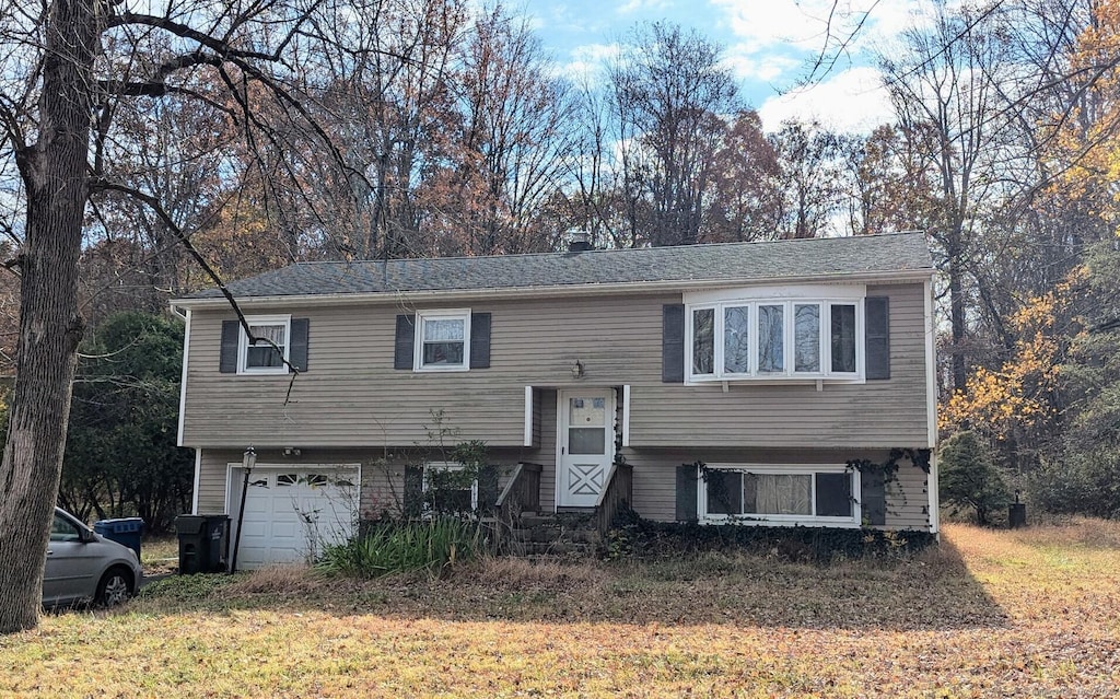 split foyer home featuring a garage