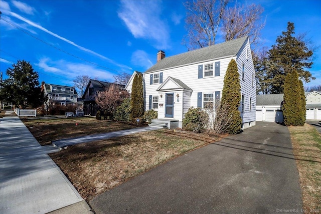 view of front of home featuring an outbuilding and a garage