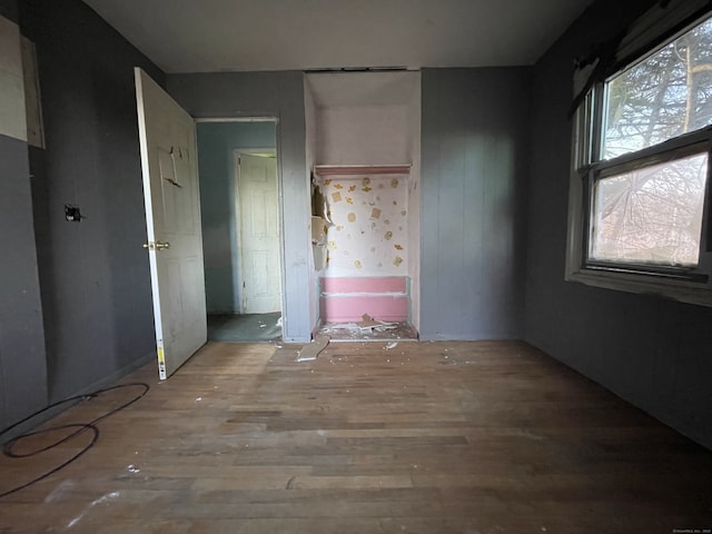 unfurnished bedroom featuring hardwood / wood-style flooring