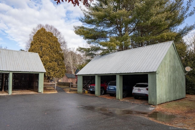 garage featuring a carport