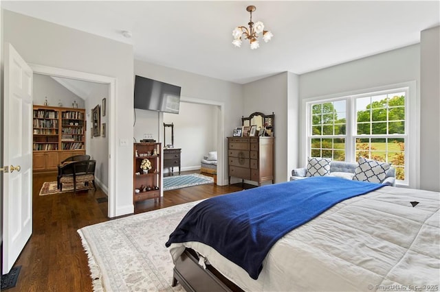 bedroom with dark wood-type flooring and a notable chandelier