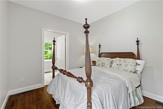 bedroom featuring dark hardwood / wood-style flooring