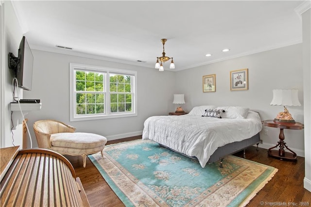 bedroom with crown molding and dark hardwood / wood-style floors